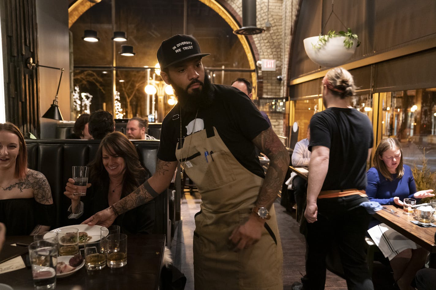 Chef and Top Chef contestant Justin Sutherland served plates of food at his restaurant the Handsome Hog in St. Paul, Minn., on Thursday, January 17, 2019. ] RENEE JONES SCHNEIDER &#xa5; renee.jones@startribune.com The restaurant hosted a six course meal before a viewing party of Top Chef, a show that Sutherland is a contestant on.