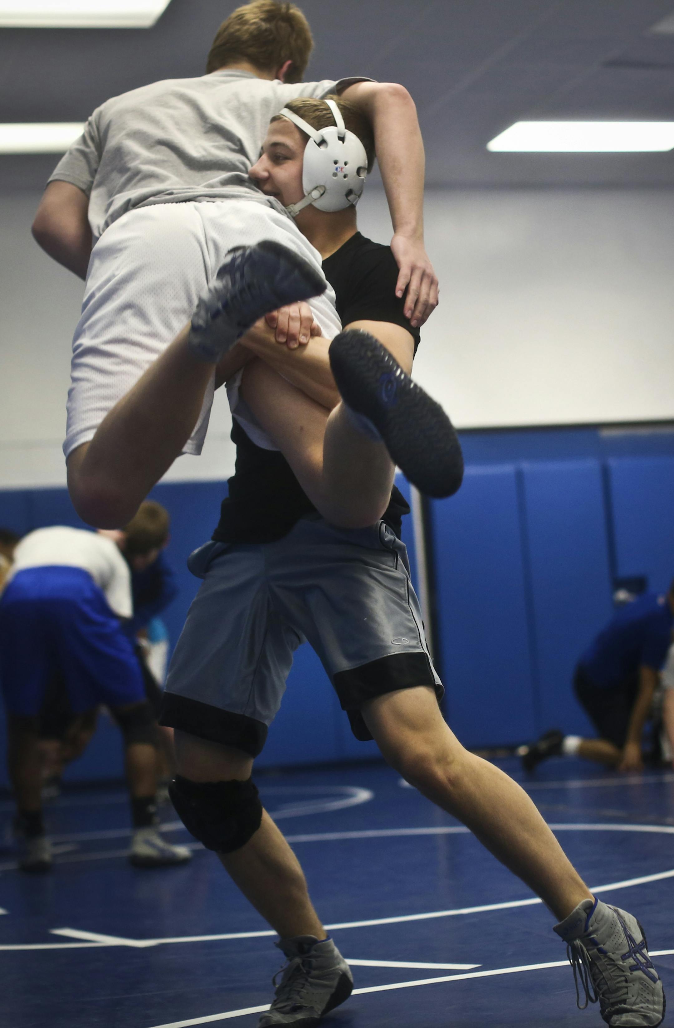 Justin Herold-Plakut wrestled teammate Anthony Doreo during practice on Tuesday, February 19, 2013, at Woodbury High School in Woodbury, Minn. ] (RENEE JONES SCHNEIDER ¬• reneejones@startribune.com) ORG XMIT: MIN1302192213474763