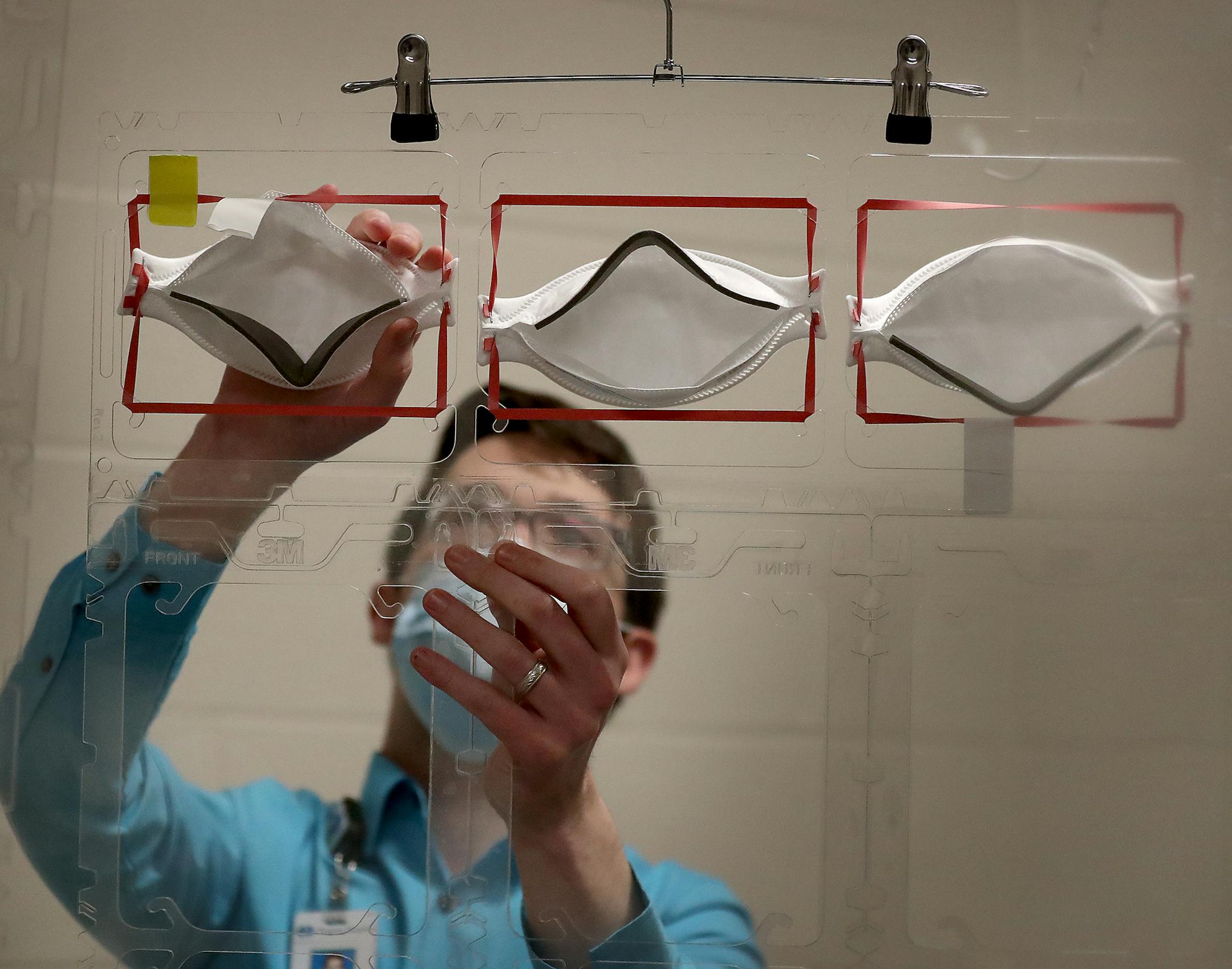 Dan Cates of Regions Hospital demonstrated a sterilization process for 3M N95 masks Wednesday in St. Paul.