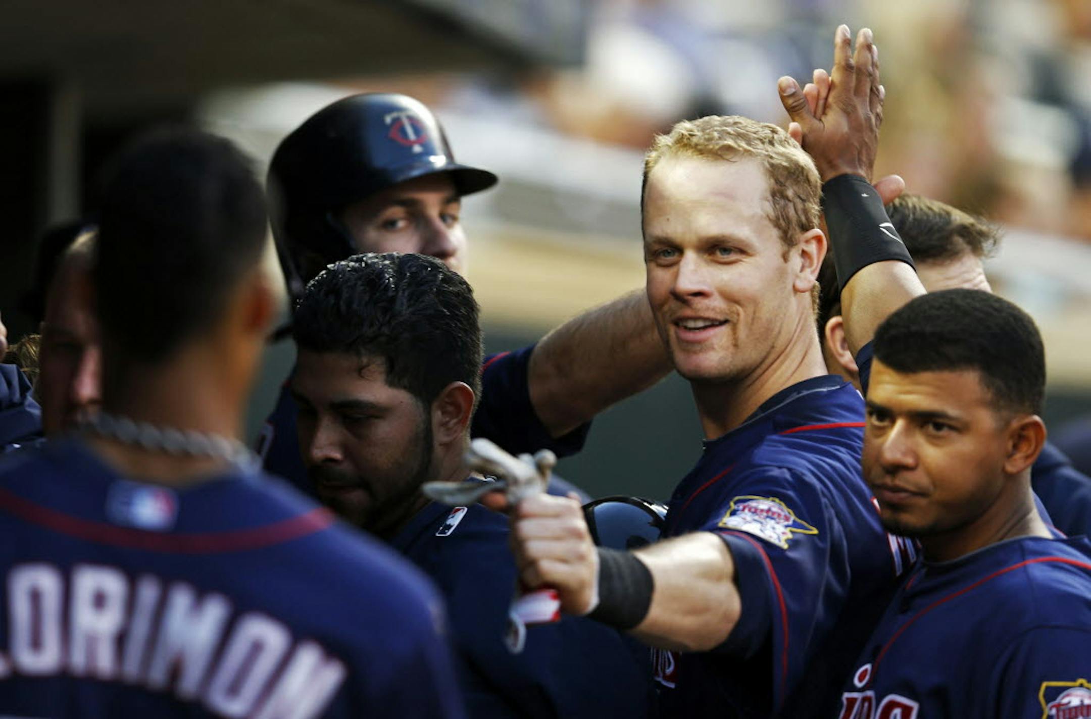 Justin Morneau, center, celebrated as the Twins went ahead 4-2 after he and Joe Mauer scored in the third inning.