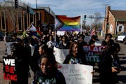 Demonstrators march to the Sandburg Education Center during A Youth for Unity rally and march before an Anoka-Hennepin school board meeting on Monday 