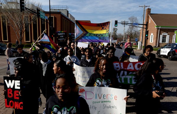 Demonstrators march to the Sandburg Education Center during A Youth for Unity rally and march before an Anoka-Hennepin school board meeting on Monday 