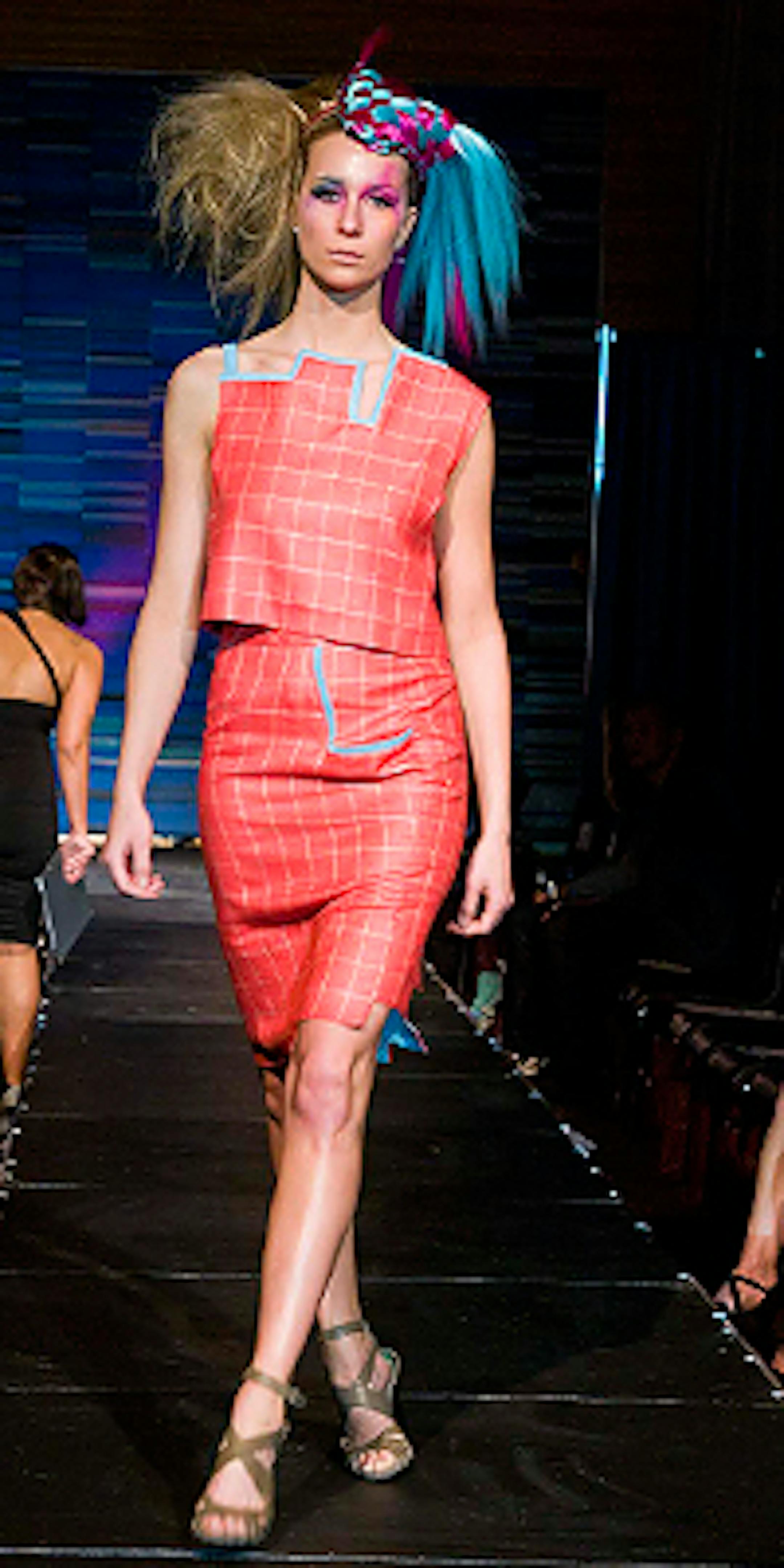 A model walks the runway during the Rocco Altobelli hair contest at the Envision show.
