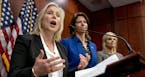 From left, Sen. Kirsten Gillibrand, D-N.Y., accompanied by Rep. Cheri Bustos, D-Ill., and former Fox News host Gretchen Carlson, speaks at a news conf