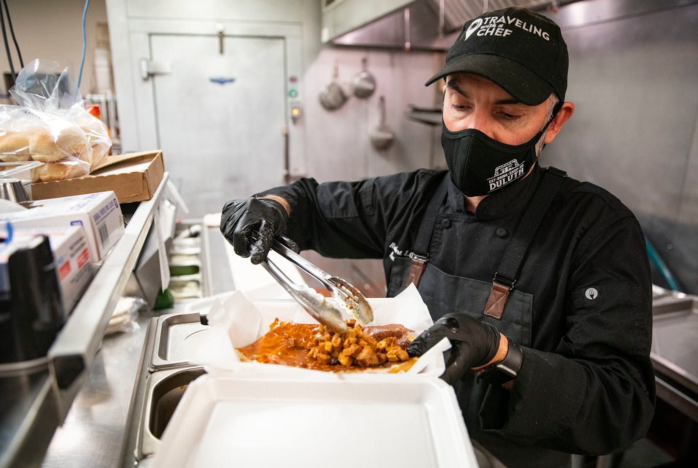 Robert Giuliani, the owner and chef of Tacos Tacos Tacos, prepared a torta in the kitchen on Wednesday, March 24, 2021. ]