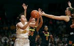 Gophers center Jessie Edwards pulled down a rebound over Terrapins forward Stephanie Jones (24) and guard Sarah Myers in the second half at Williams A