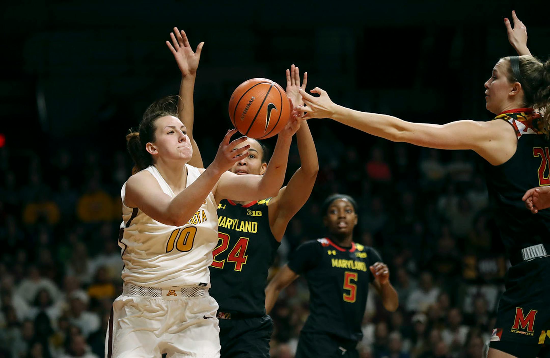 Gophers center Jessie Edwards pulled down a rebound over Terrapins forward Stephanie Jones (24) and guard Sarah Myers in the second half at Williams Arena on Sunday.