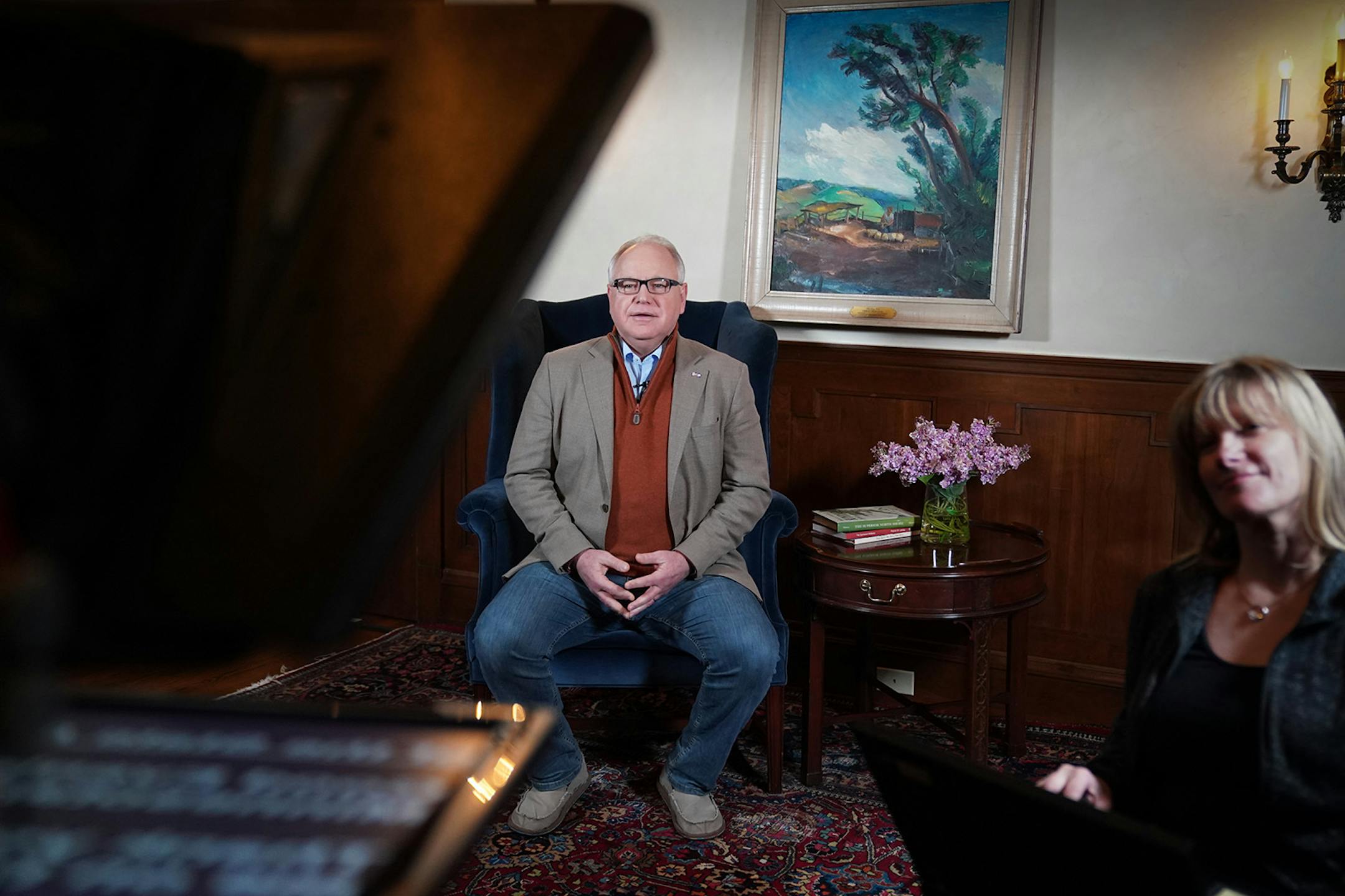 Minnesota Gov. Tim Walz prepared to deliver his State of the State address over YouTube from his residence. At right is prompter operator Laura Hammerbeck.