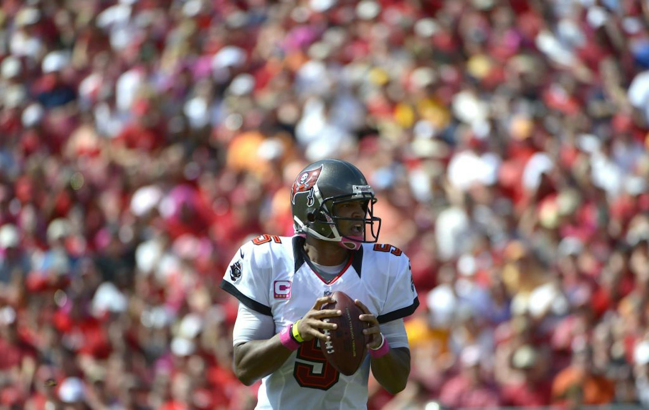 Tampa Bay Buccaneers quarterback Josh Freeman (5) drops back to pass during the first half of an NFL football game against the Kansas City Chiefs in Tampa, Fla., Sunday, Oct. 14, 2012.