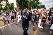 John Thompson, activist and candidate for Minnesota state representative, marched outside St. Anthony Village City Hall for Philando Castile. A rally 