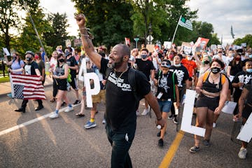 John Thompson, activist and candidate for Minnesota state representative, marched outside St. Anthony Village City Hall for Philando Castile. A rally 