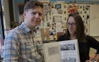 Samuel Skinner, 16, (left) and Courtney Major (right) pose for a portrait holding a Murray Middle School year book from 1946 in Major&#x2019;s classro
