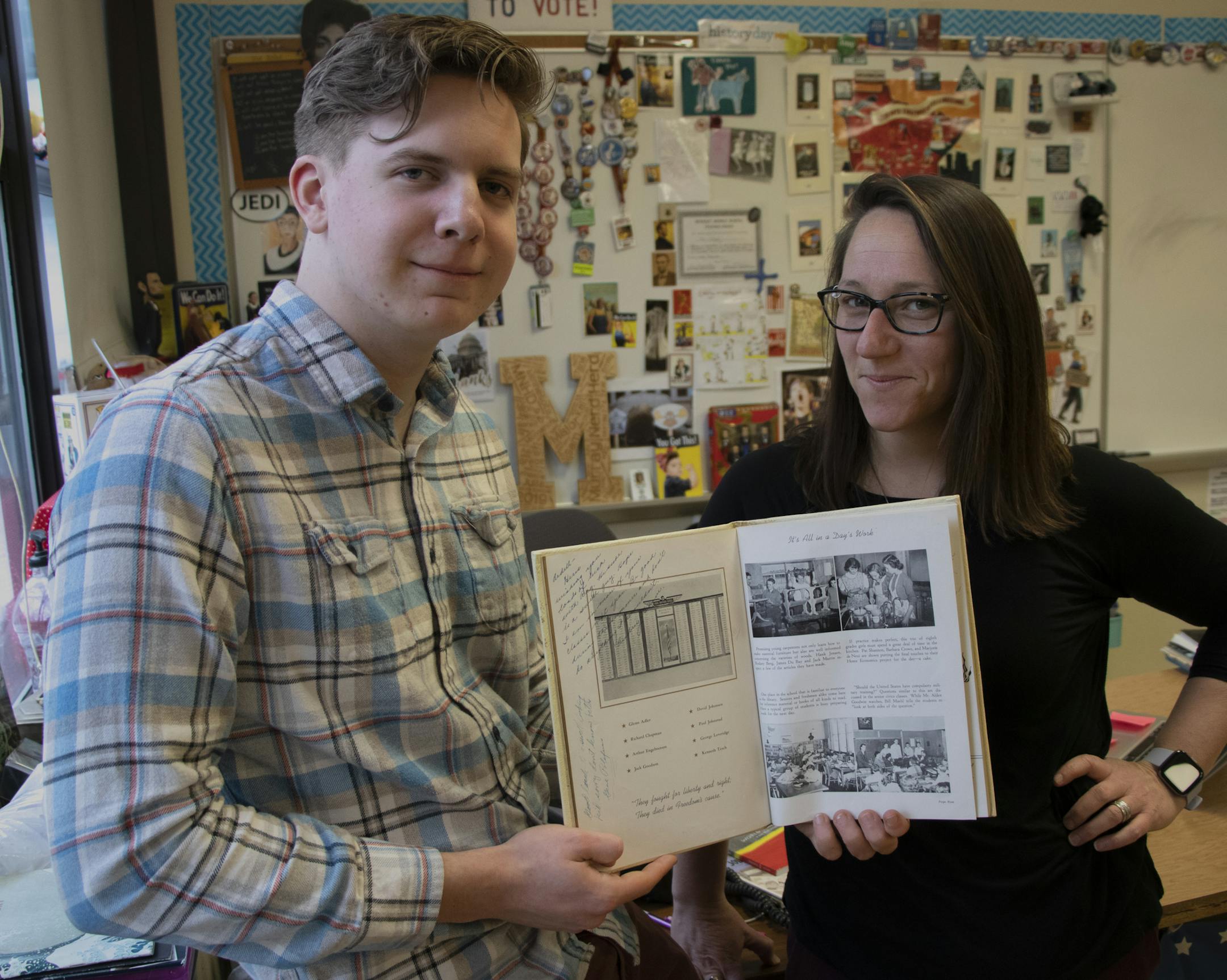 Samuel Skinner, 16, (left) and Courtney Major (right) pose for a portrait holding a Murray Middle School year book from 1946 in Major’s classroom on Wednesday, Feb. 12, 2020 at Murray Middle School in St.Paul, MN. He and Major used this page to find the name of Arthur B. Engebretson, an alumnus of the school, who was killed in action on the USS O’Brien-725 in the Pacific theater of World War II. Skinner and Major are one of 16 student-teacher teams chosen to participate in Sacrific