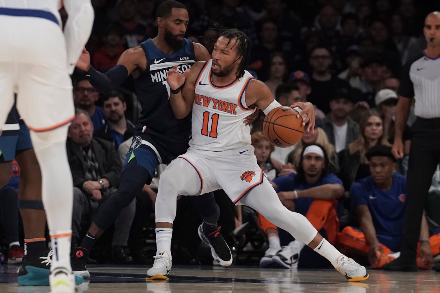 New York Knicks' Jalen Brunson, right, dribbles against Minnesota Timberwolves' Mike Conley during a preseason NBA basketball game, Saturday, Oct. 14, 2023, in New York. (AP Photo/Bebeto Matthews)