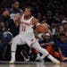 New York Knicks' Jalen Brunson, right, dribbles against Minnesota Timberwolves' Mike Conley during a preseason NBA basketball game, Saturday, Oct. 14,