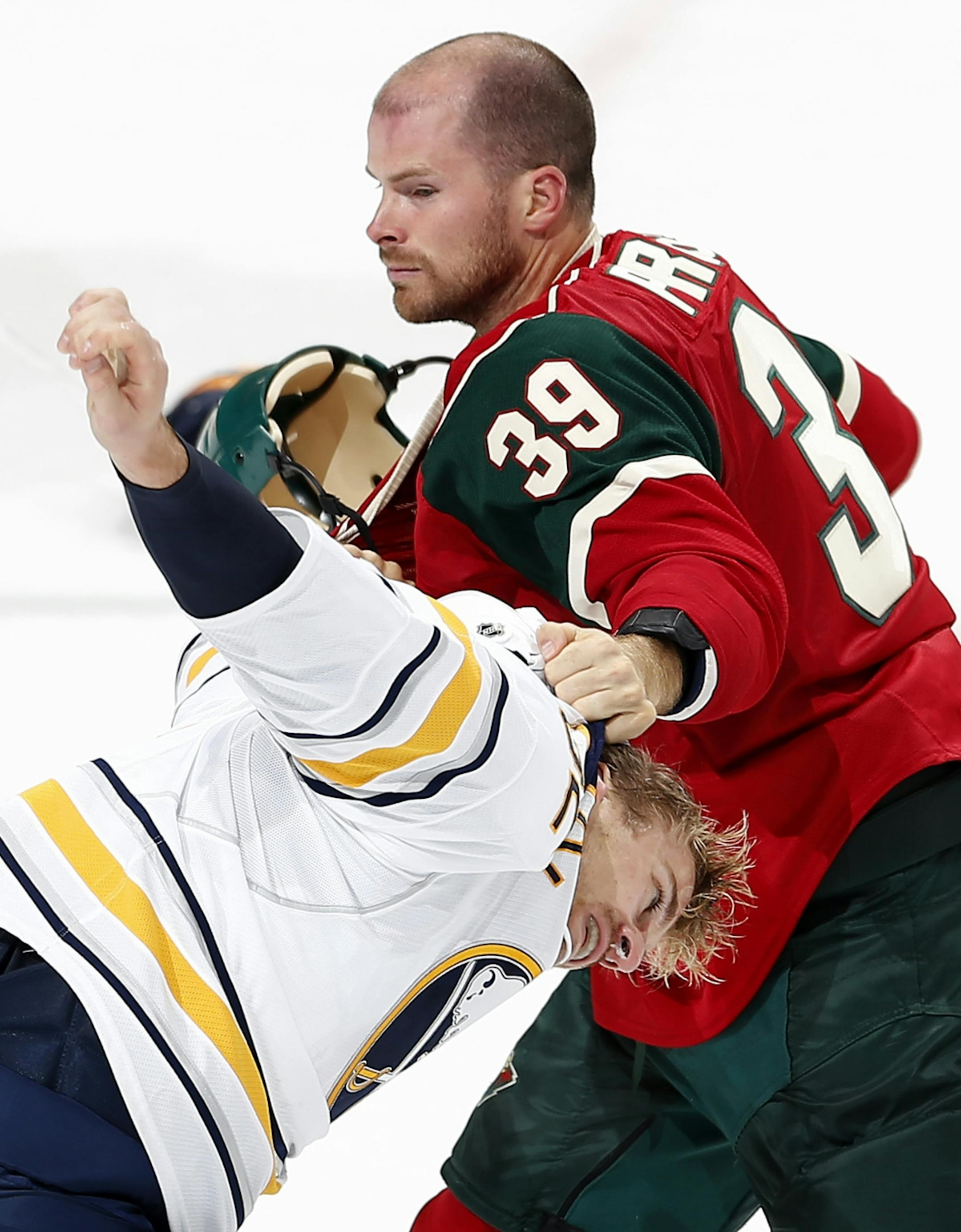 Nate Prosser (39) and Marcus Foligno (82) fought during exhibition overtime.