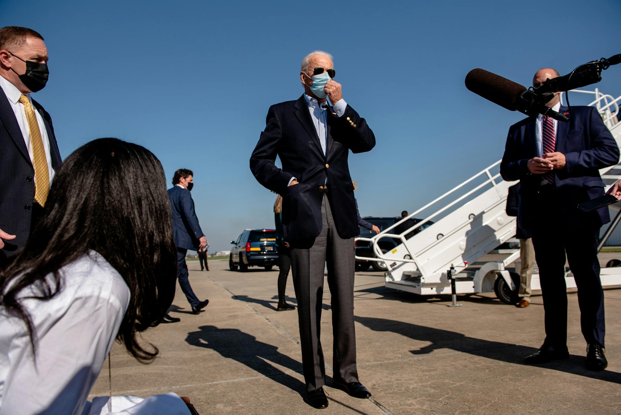 FILE -- Joe Biden, the Democratic presidential candidate, speaks to reporters before boarding his plane in New Castle, Del., Oct. 22, 2020. President Donald Trump turned American foreign policy inside out, to the benefit of some nations and consternation of others and now both groups are watching attentively to see which direction the U.S. goes next. (Hilary Swift/The New York Times)