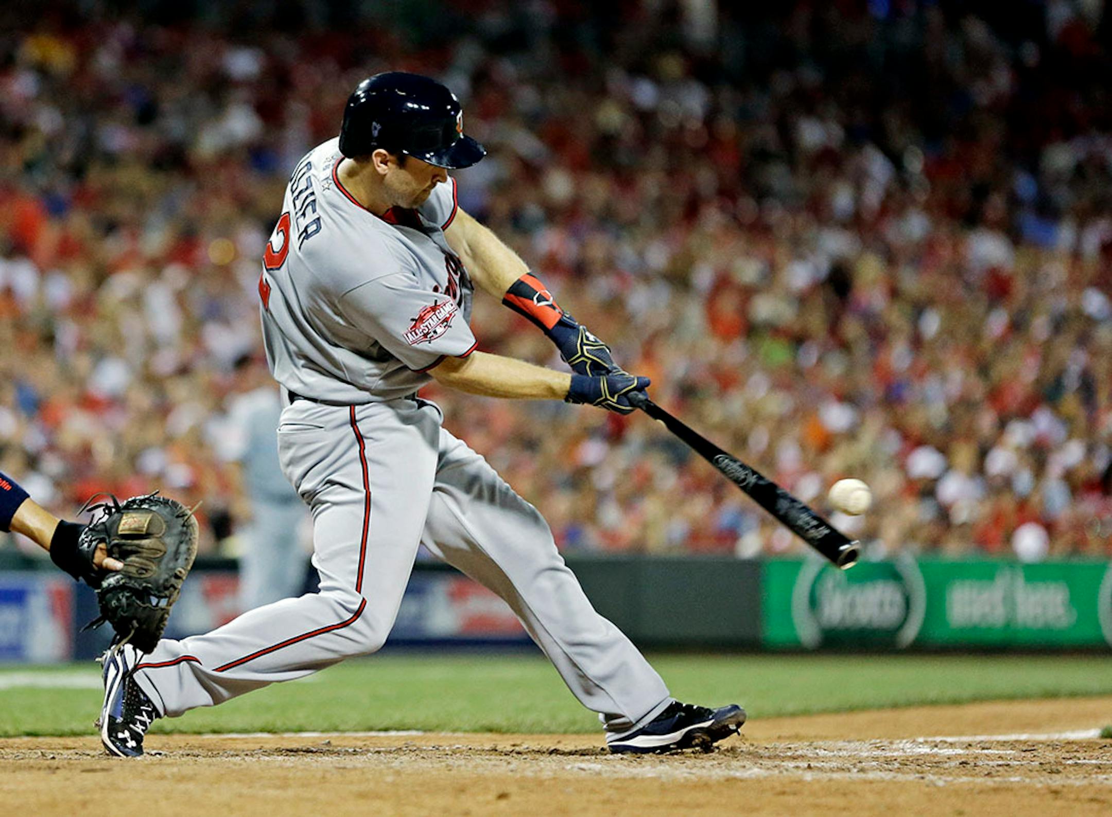 American League's Brian Dozier, of the Minnesota Twins, hits a home run during the eighth inning of the MLB All-Star baseball game, Tuesday, July 14, 2015, in Cincinnati.
