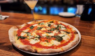 Zelo is back, and so is its margherita pizza.