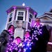 A holiday light display in Chaska by the Staudt family pays homage to Prince. Members of the Staudt family posed for a photo, including dad Mike, righ