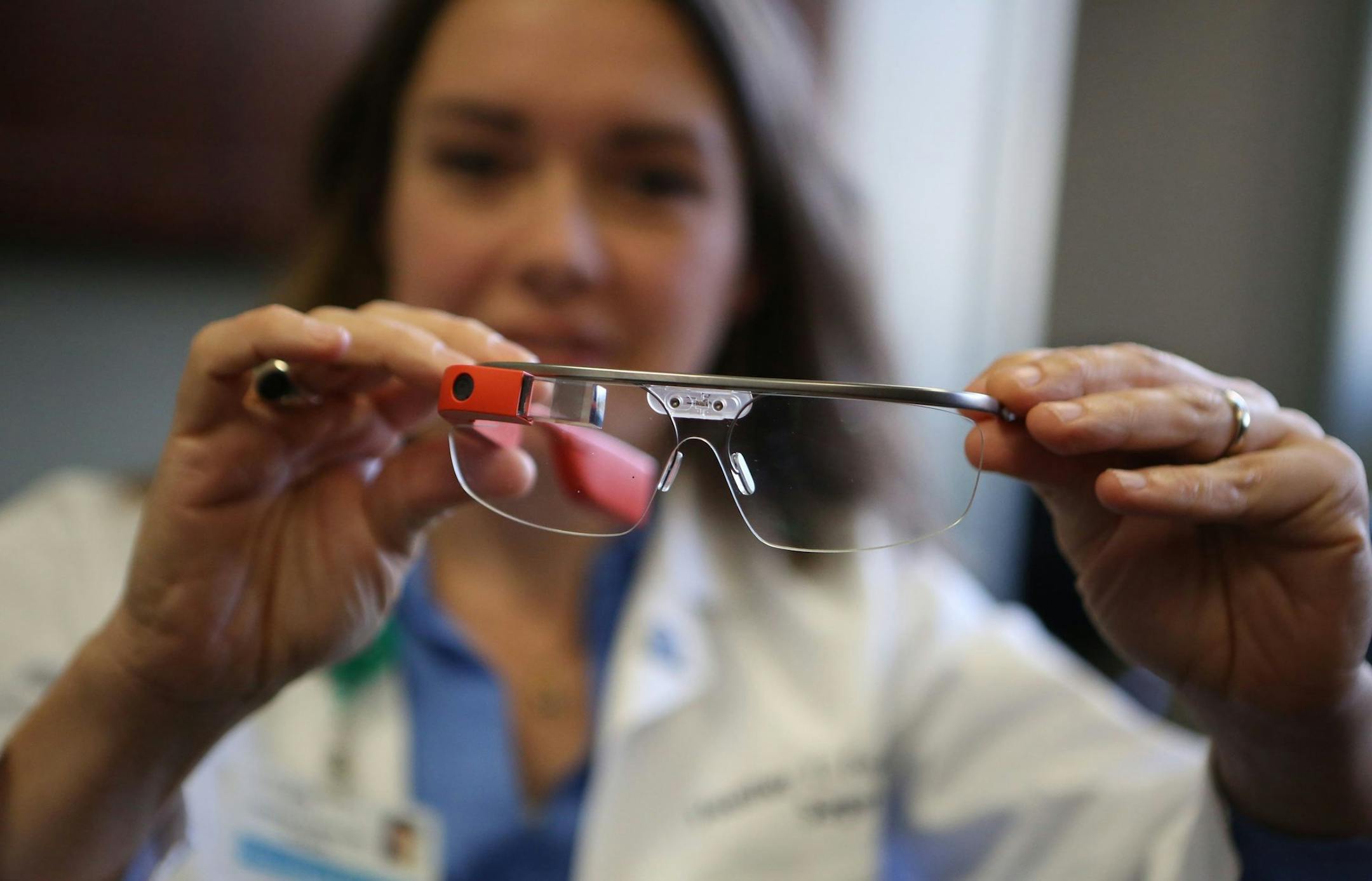 Dr. Heather Evans of Seattle tested Google Glass during surgery realizing its benefits, quick access to the patient's medical records for one, and downsides, interacting with the device took her concentration away from the patient. She only wore the device for a short time in surgery and with the patient's permission. (Ken Lambert/Seattle Times/MCT) ORG XMIT: 1145861 ORG XMIT: MIN1311212311011407