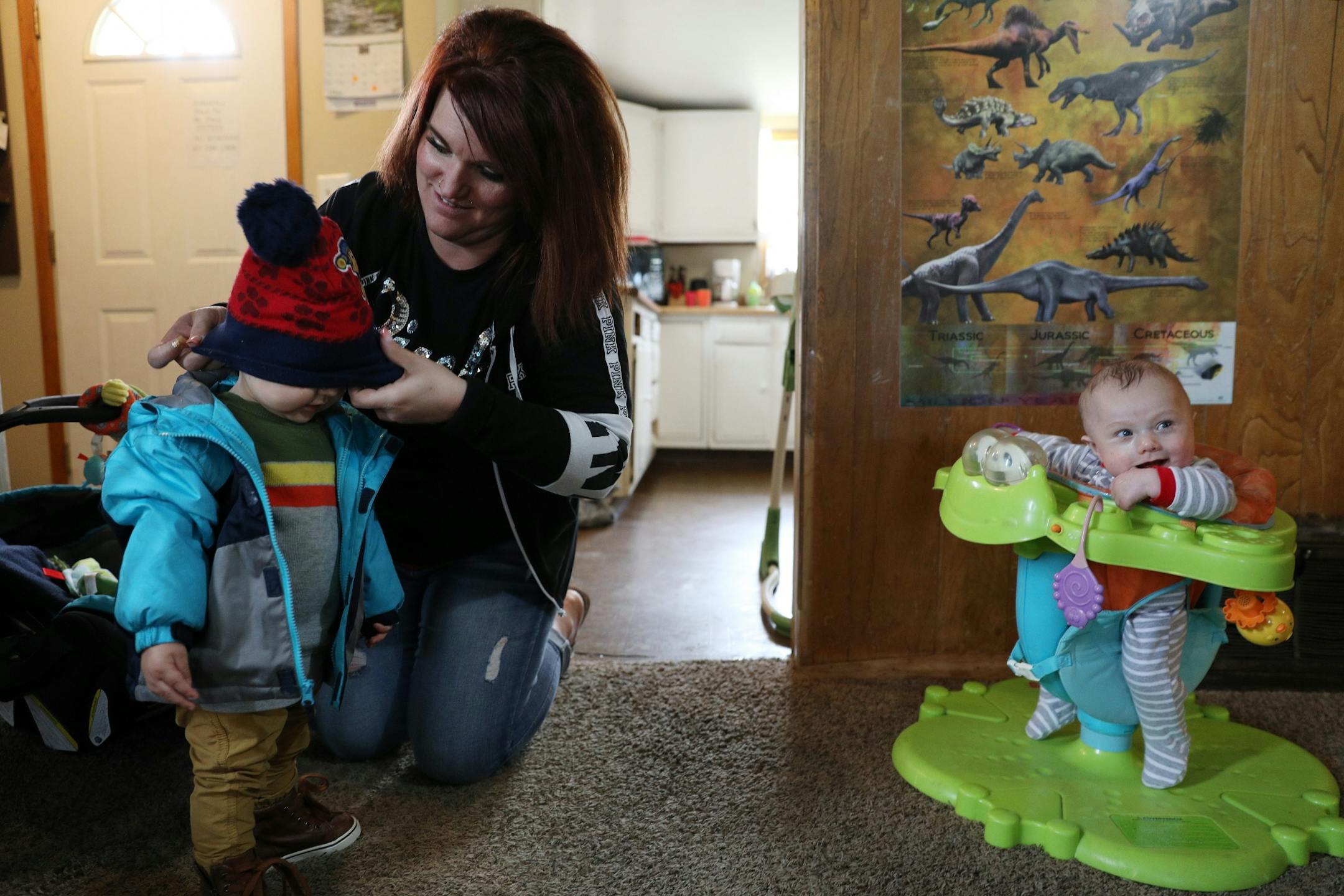 Ashley Benson, a mother of four who went through Sanford Bemidji Medical Center's First Steps program to help pregnant opioid addicts wean off their addictions, picked up her son Raymond Burnette, 15-months, from daycare.