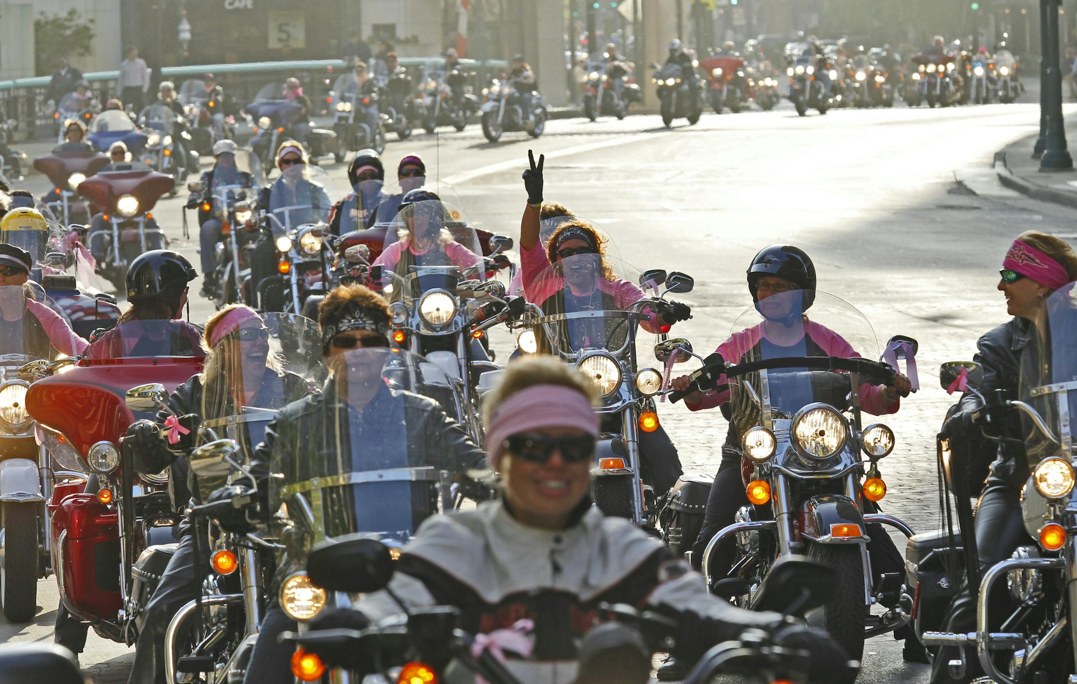 Women riders rev their Harley-Davidson engines during a parade through downtown Milwaukee during the Women Riders Month celebration in Saturday May. 22, 2010. (Jeffrey Phelps/AP Images for Harley-Davidson)