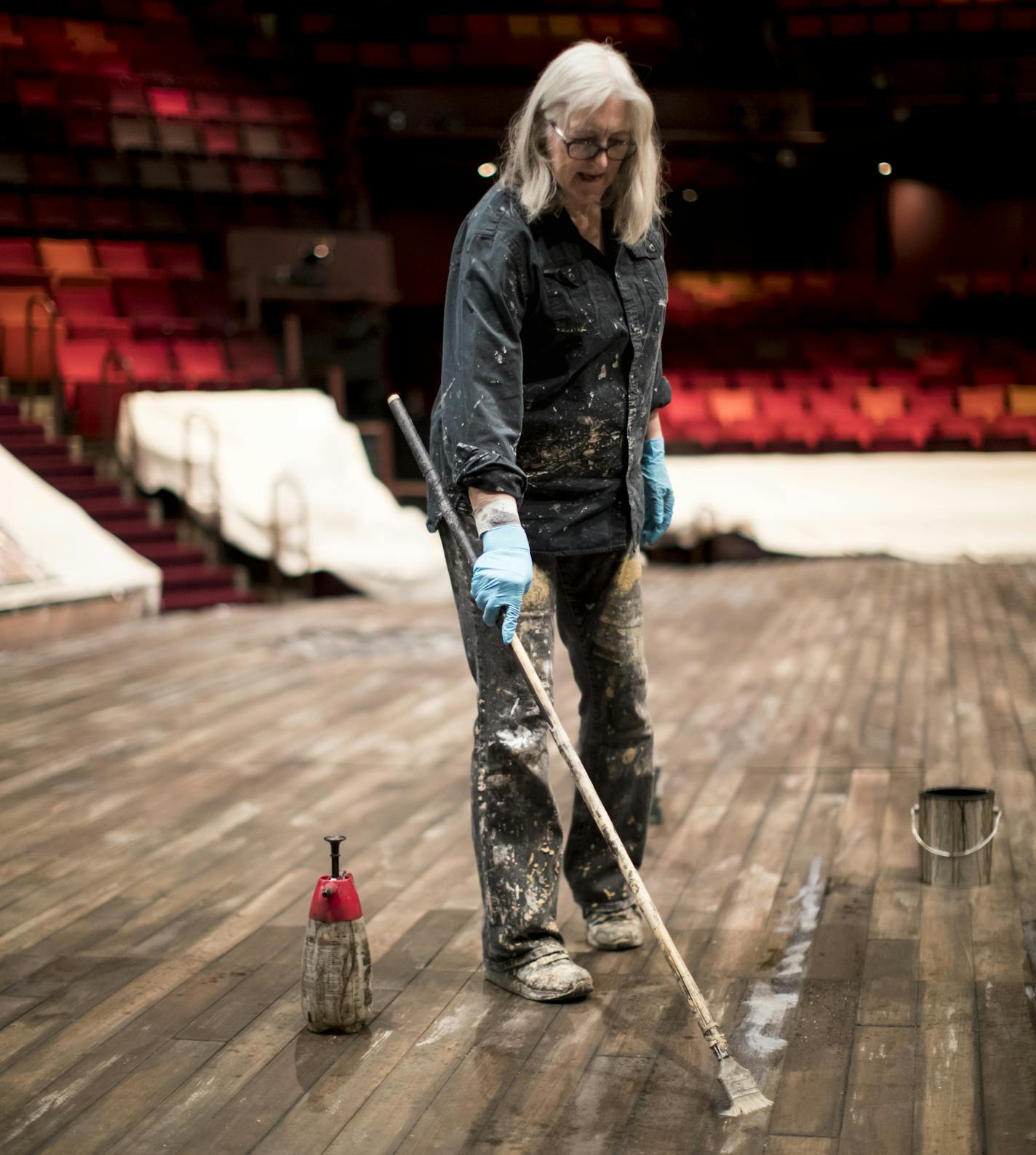 Scenic artist Rebecca Pavlenko worked on a floor that was meant to look like an old wood floor for the set of Indecent at the Guthrie Theater on Friday, January 12, 2018, in Minneapolis, Minn. ] RENEE JONES SCHNEIDER &#x2022; renee.jones@startribune.com