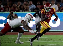 USC wide receiver Jordan Addison (3) makes a catch against Fresno State linebacker Raymond Scott (1) in the first quarter at the Los Angeles Memorial 