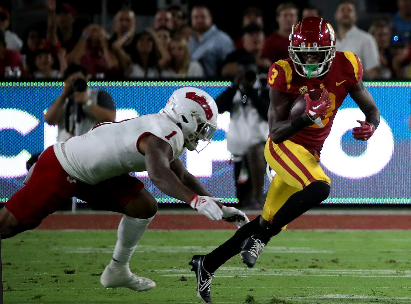 USC wide receiver Jordan Addison (3) makes a catch against Fresno State linebacker Raymond Scott (1) in the first quarter at the Los Angeles Memorial Coliseum on Saturday, Sept. 17, 2022, in Los Angeles. (Luis Sinco/Los Angeles Times/TNS) ORG XMIT: 66986670W