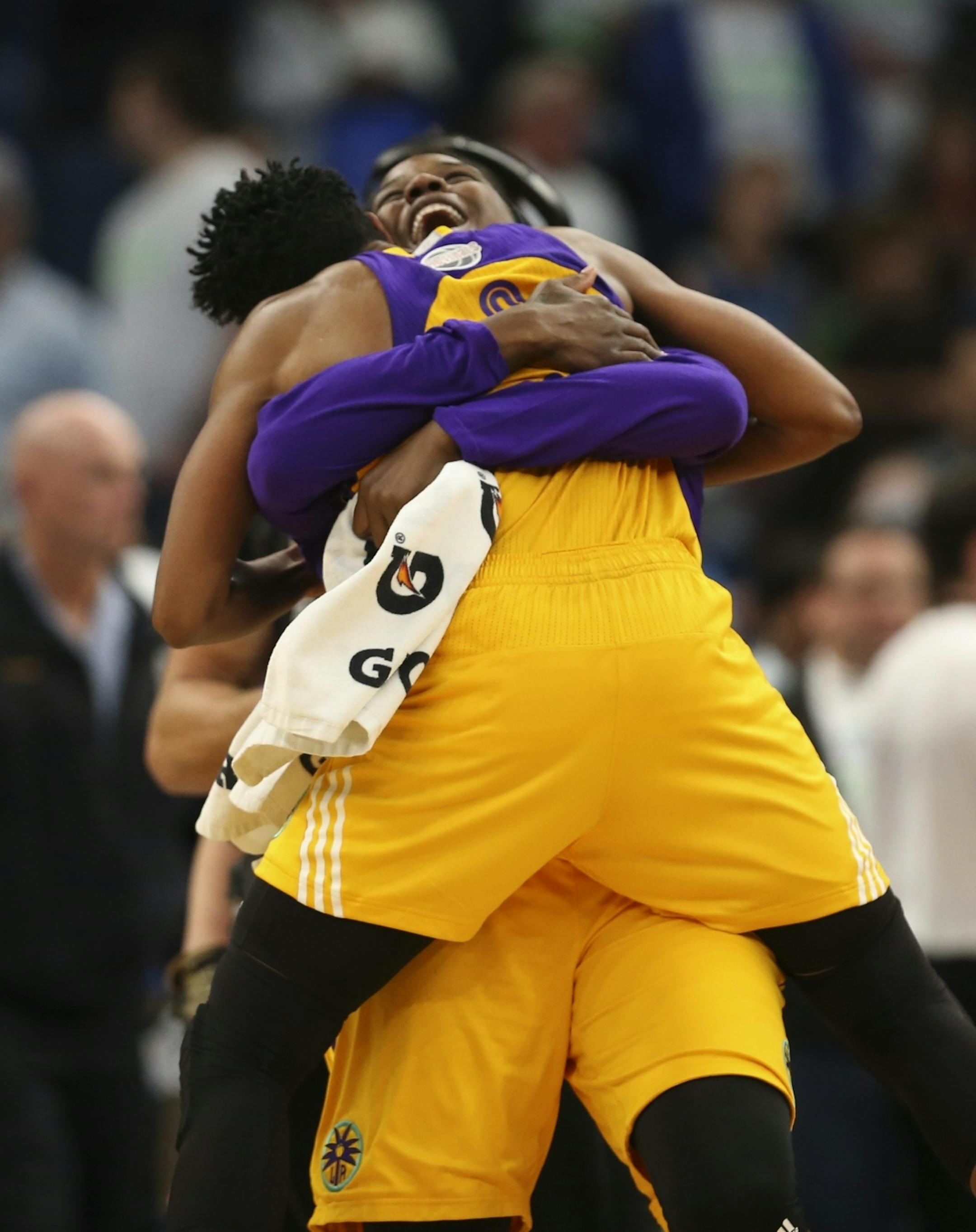 The Los Angeles Sparks' Jantel Lavender hugged Los Angeles Sparks guard Alana Beard (0) after Beard hit the game winner to defeat the Lynx 78-76 Sunday afternoon.
