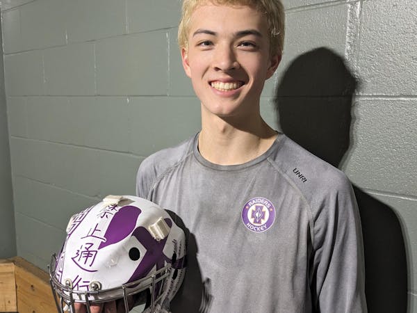 Cretin-Derham Hall's Owen Nelson, with the goalie mask that reflects his culture.