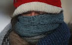 Betsy Ranum bundled up in 2014 ahead of a week of polar vortex bone-chilling weather. What will this winter bring for Minnesota? Many forecasts are al