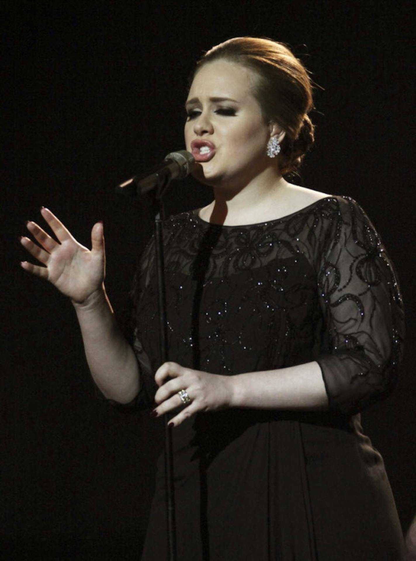 Adele in healthier times at the Brit Awards in February. / Photo by Joel Ryan for AP