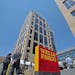 Wells Fargo employees and visitors watched as executives and city officials celebrated the grand opening of Minneapolis East Town Towers, Wednesday, J