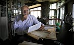 JIM GEHRZ � jgehrz@startribune.com Maple Plain/June 23, 2009/9:30AM Minneapolis businessman Wheelock Whitney looked over newspaper clippings from th