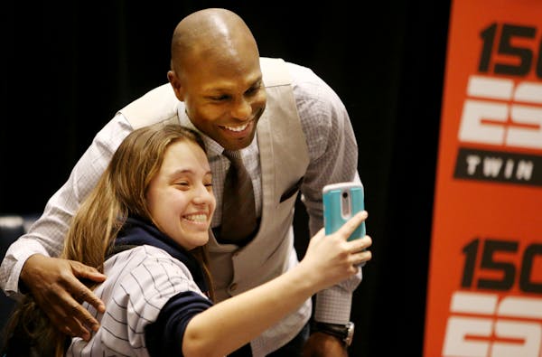 Heather Ziskovsky of Prior Lake was a bit giddy when she convinced newly retired Twin Torii Hunter to join her for a selfie at Twinsfest, Friday, Jan.