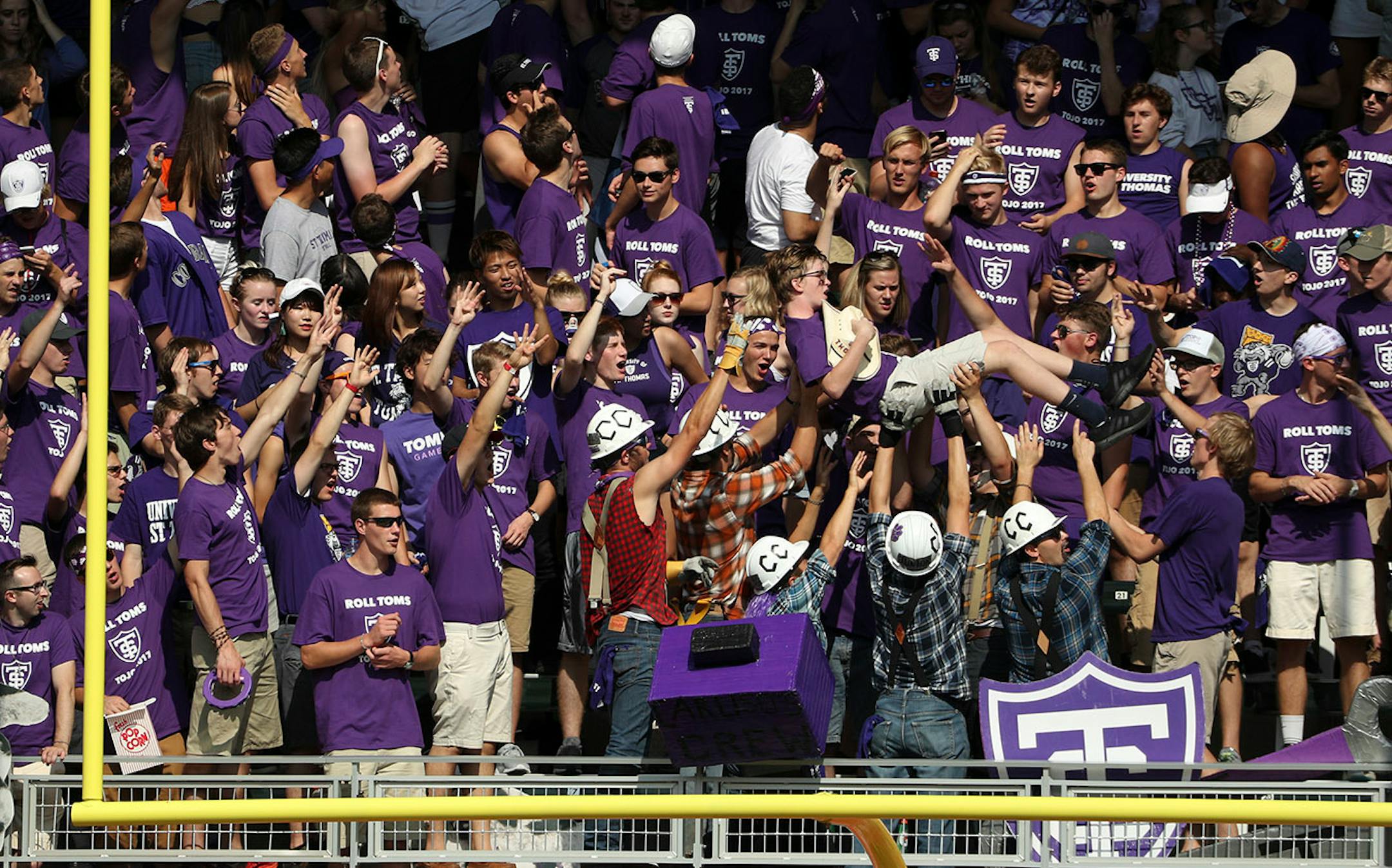 University of St. Thomas fan celebrated in the stands after University of St. Thomas' Gabe Green (6) scored a touchdown in the first half.