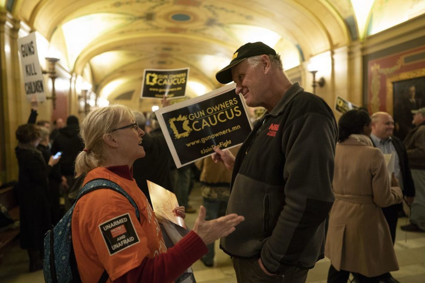 Katherine Schafer, left, of Protect Minnesota , and Jack Johnson of theGun Owners Caucus spoke durning Wednesday's House Public Safety Committee hearing at the State Capitol in St. Paul.