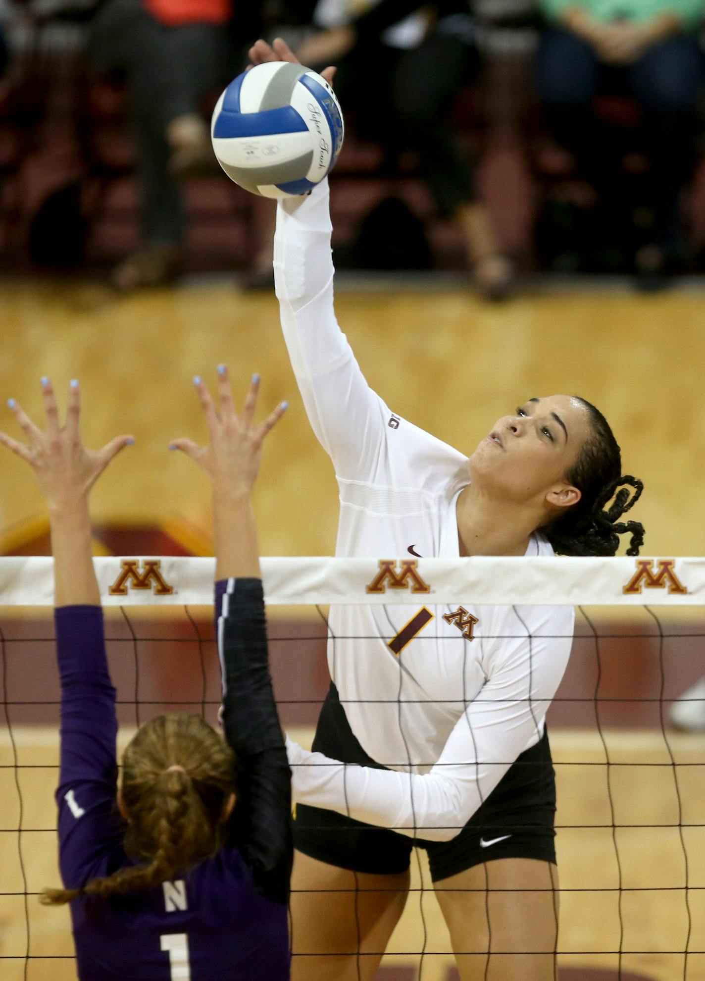 Gophers Daly Santana spiked the ball during the first set. ] (KYNDELL HARKNESS/STAR TRIBUNE) kyndell.harkness@startribune.com Gophers vs Northwestern at the Sports Pavillion at the University of Minnesota in Minneapolis Min., Wednesday September 30, 2015.