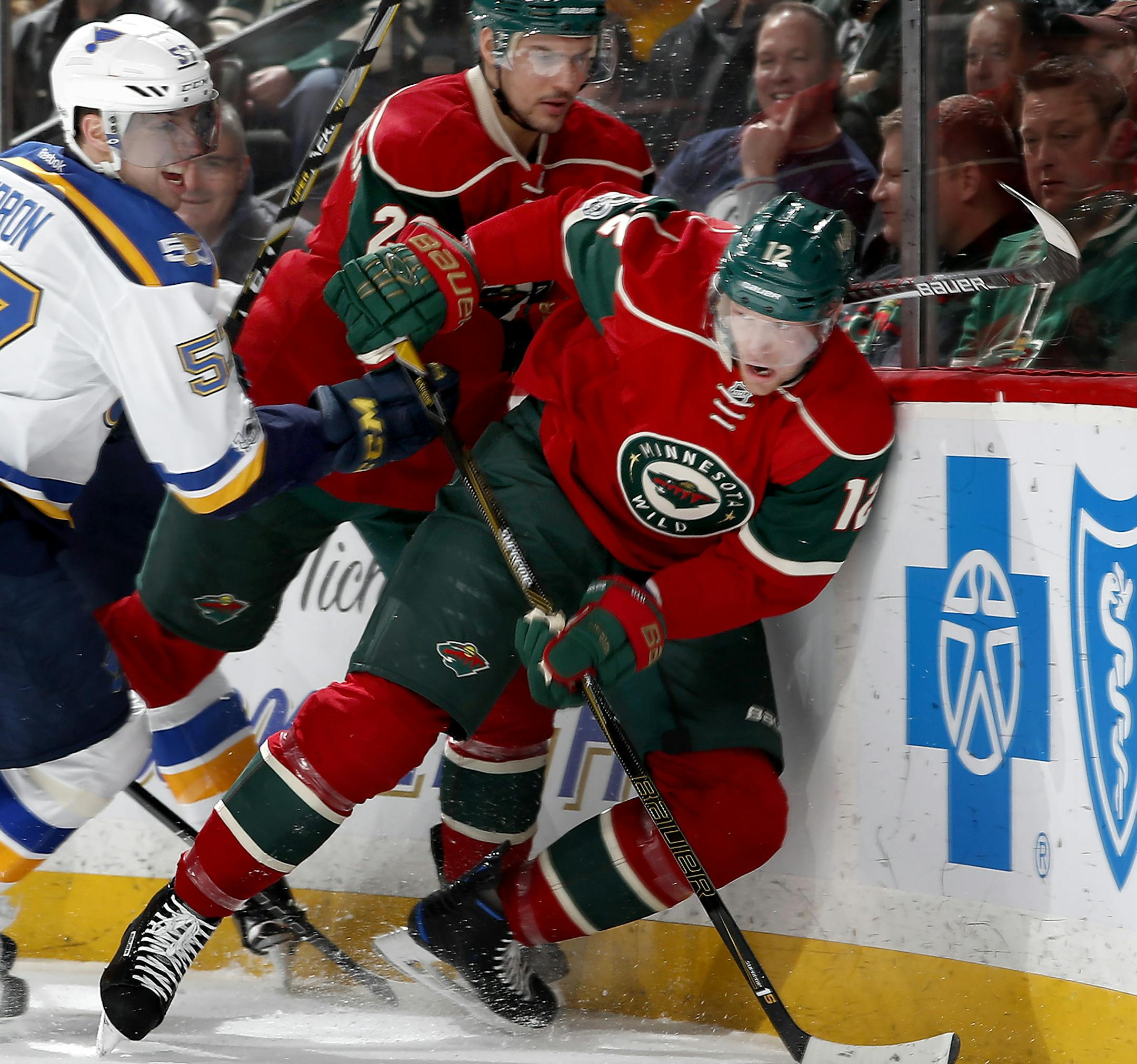 David Perron (57) and Eric Staal (12) fought for the puck in the first period. ] CARLOS GONZALEZ &#xef; cgonzalez@startribune.com - January 26, 2017, St. Paul, MN, Xcel Energy Center, NHL, Hockey, St. Louis Blues at Minnesota Wild