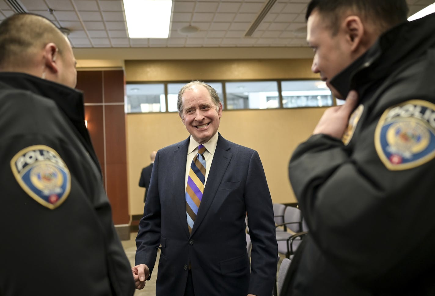 New Metropolitan Council Chair Charlie Zelle spoke to Metro Transit Police Officers David Tan, left, and Liam Pham after Zelle's swearing-in ceremony Wednesday. ] Aaron Lavinsky &#x2022; aaron.lavinsky@startribune.com Charlie Zelle, the new Metropolitan Council chair, was sworn by Lt. Gov. Peggy Flanagan on Wednesday, Jan. 8, 2020 in the council chambers in St. Paul, MInn.