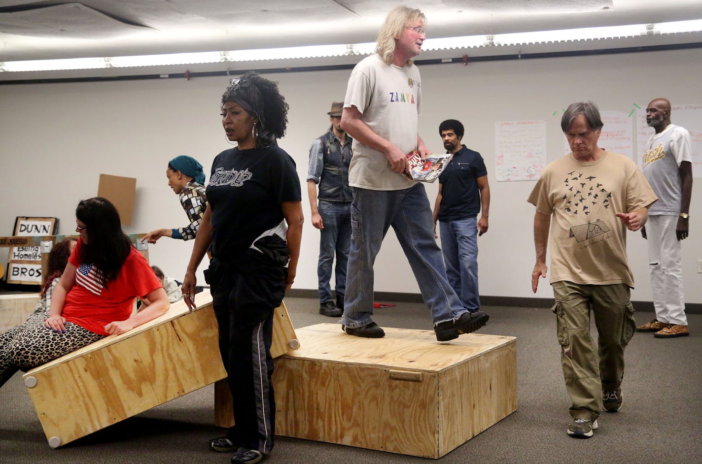 Cast members rehearse for "Home Street Home," a show that features currently and formerly homeless actors Saturday, Aug. 27, 2016, at St. Stephen's in Minneapolis, MN. Here, among the actors is Richard Brinda, center, elevated on box.