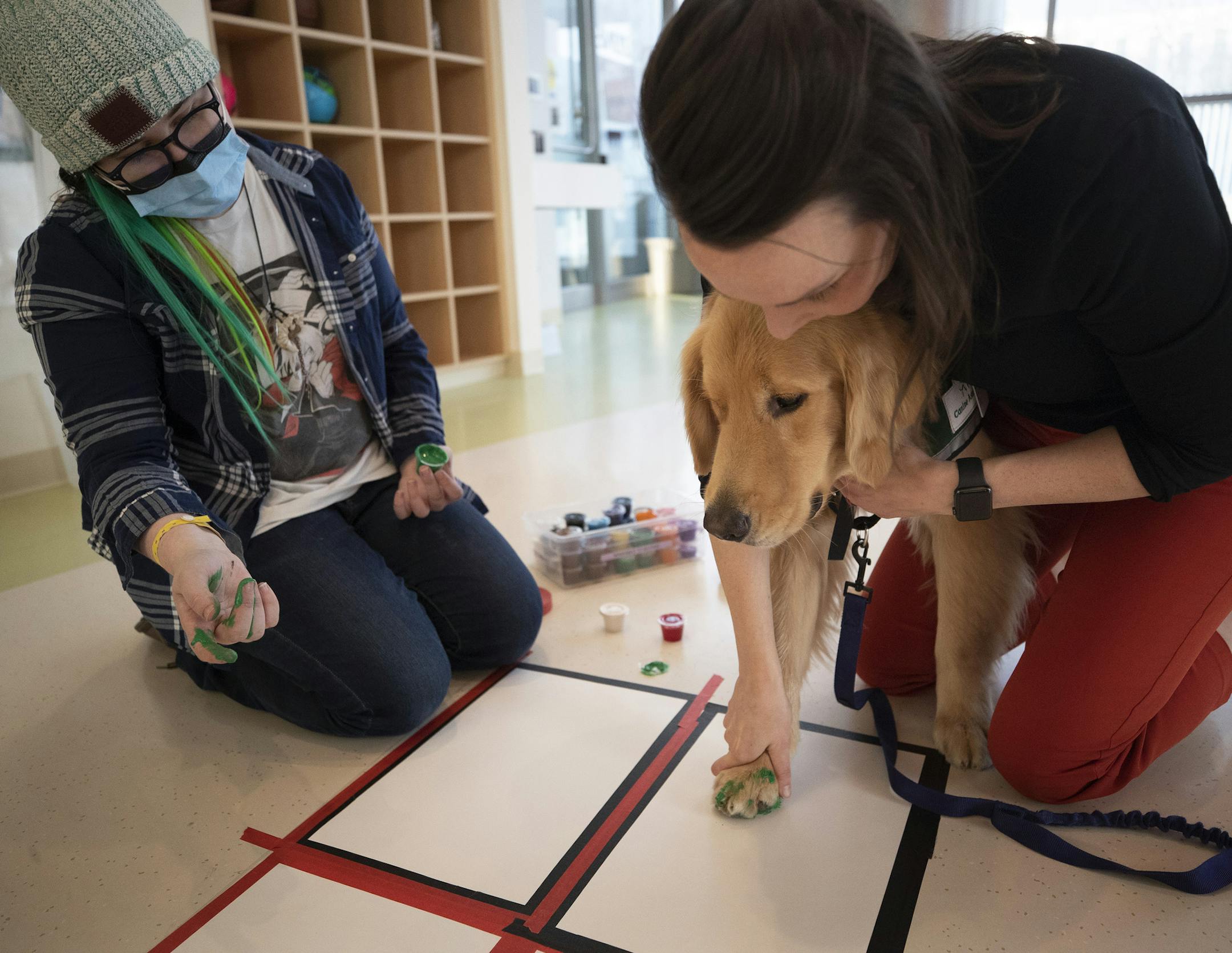 Child-life specialist Anna Dressel got a paw print from "Rocket" as former hospital patient Emmy Reeves, 14, of South Carolina looked. ] Jerry Holt • Jerry.Holt@startribune.com Rocket the new service dog at the U of M Masonic Children's Hospital is unique in that it has been specially trained to stay with kids and keep them calm through medical procedures, etc. Therapy dogs can smell/spot seizures and diabetic comas for chronically ill patients. Om Tuesday afternoon Rocket visited patient