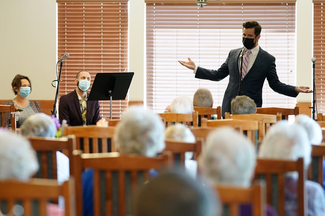 Skylark Opera's Luke Williams sang with a mask on during a performance at the Savage Senior Living at Fen Pointe.