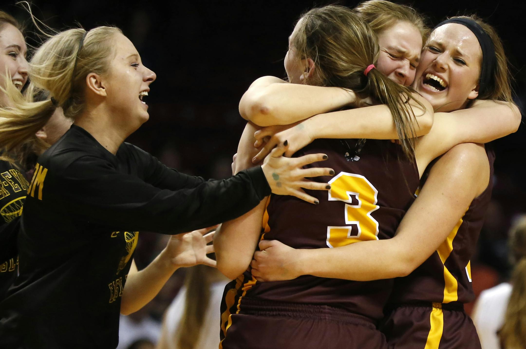 Dover-Eyota celebrated their championship win. ] (KYNDELL HARKNESS/STAR TRIBUNE) kyndell.harkness@startribune.com Class 2A girls' basketball finals Dover-Eyota vs Sauk Center at Williams Arena in Minneapolis Min., Saturday, March 21, 2015. Dover-Eyota won over Sauk Center 71-58