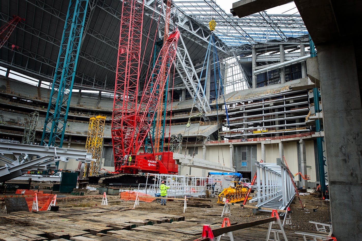 A concrete seating section panel is moved into position in the new Vikings stadium. Thursday, May 14, 2015 Construction update of the new Vikings stadium, Minneapolis, MN