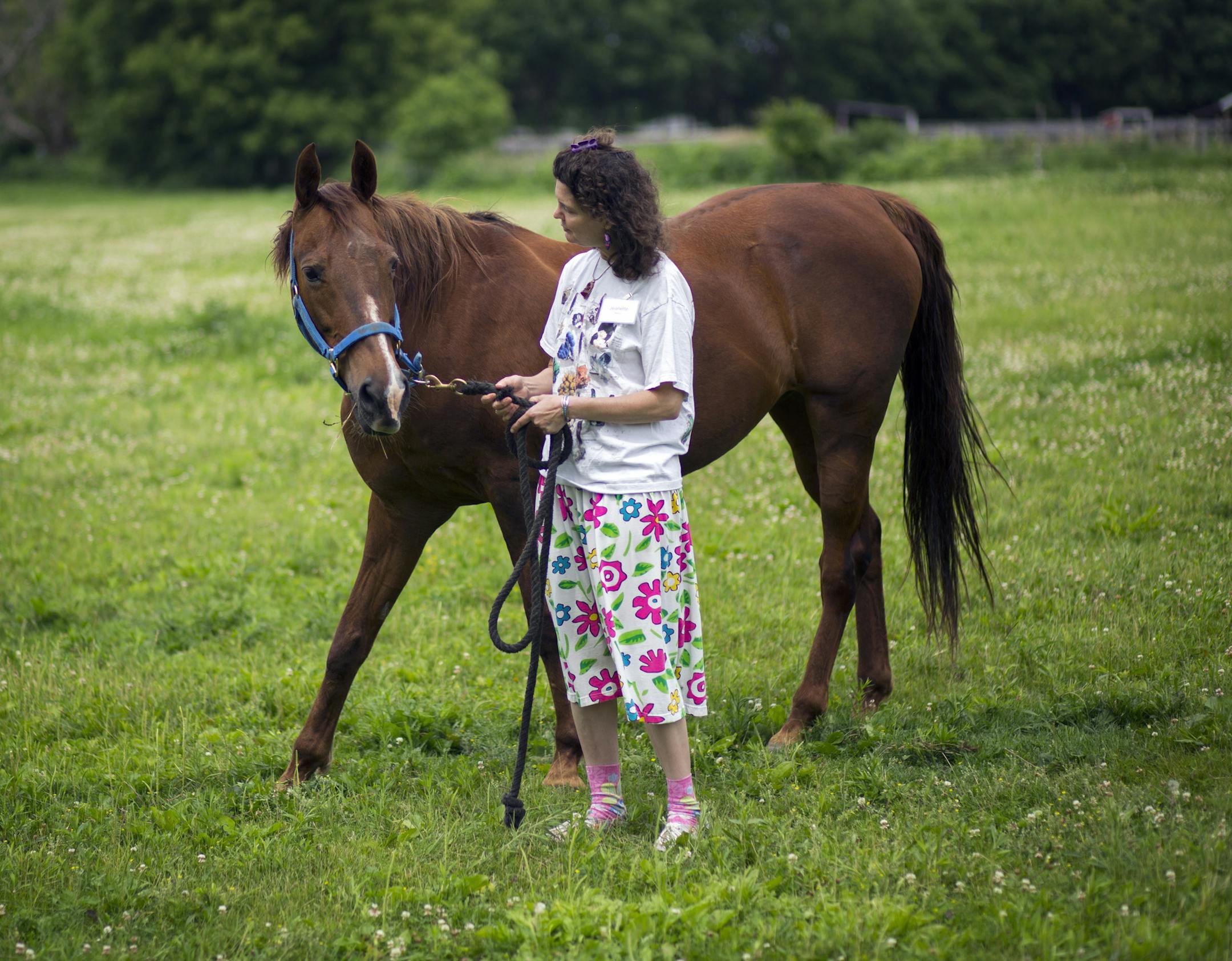 Jeanette Mayo makes a connection with a horse.