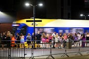 Concert goers wait for the next light rail train after a Taylor Swift concert Friday, June 23, 2023, outside US Bank Stadium in Minneapolis.