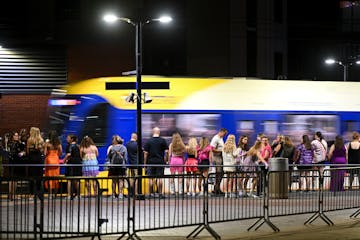 Concert goers wait for the next light rail train after a Taylor Swift concert Friday, June 23, 2023, outside US Bank Stadium in Minneapolis.